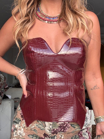 The burgundy leather corset